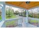 Covered front porch with wood ceiling and view of front yard and driveway at 6282 Richburg Rd, Great Falls, SC 29055