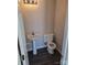 Half bathroom featuring a pedestal sink, dark LVP flooring, and neutral paint at 649 Favorwood Dr, Rock Hill, SC 29730