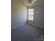 Cozy bedroom with neutral walls, carpeted flooring, and a window offering natural light at 649 Favorwood Dr, Rock Hill, SC 29730