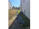 Side yard with drainage ditch and rock detail at 649 Favorwood Dr, Rock Hill, SC 29730