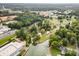 A high-angle aerial view of a residential area, featuring lush greenery, houses, and waterways at 7790 Blackwood Rd, Denver, NC 28037