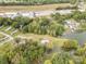 Aerial view of waterfront homes featuring private docks, set amidst lush trees and serene waters at 7790 Blackwood Rd, Denver, NC 28037