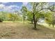 Mature trees in the yard providing shade and a natural aesthetic to the property at 7790 Blackwood Rd, Denver, NC 28037