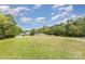 The beautiful lawn provides a lovely view of the calm water and the surrounding mature trees at 7790 Blackwood Rd, Denver, NC 28037