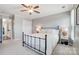 Inviting bedroom with a bed, ceiling fan, and ample closet space at 8250 Tradd Ct, Charlotte, NC 28210