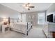 Serene bedroom with neutral tones, natural light, and comfortable furnishings at 8250 Tradd Ct, Charlotte, NC 28210