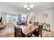 Inviting dining room with hardwood floors that opens to the living room, perfect for entertaining at 8250 Tradd Ct, Charlotte, NC 28210