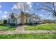 Beautifully landscaped townhouse with a well-manicured lawn and inviting curb appeal at 8250 Tradd Ct, Charlotte, NC 28210