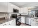 Modern kitchen showcasing stainless steel appliances and stylish countertop design at 8250 Tradd Ct, Charlotte, NC 28210