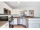 Well-equipped kitchen with stainless steel appliances and ample countertop space at 8250 Tradd Ct, Charlotte, NC 28210