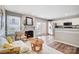 Inviting living room with fireplace adjacent to kitchen and stainless steel appliances at 8250 Tradd Ct, Charlotte, NC 28210