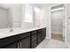 Modern bathroom with double vanity and dark cabinetry at 9650 Liberty Hill Dr, Mint Hill, NC 28227