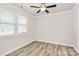 Bright bedroom with hardwood floors and two windows at 9650 Liberty Hill Dr, Mint Hill, NC 28227