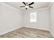 Bright bedroom with hardwood floors, ceiling fan, and a window at 9650 Liberty Hill Dr, Mint Hill, NC 28227