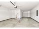 Spacious garage features a smooth concrete floor and automatic door at 9650 Liberty Hill Dr, Mint Hill, NC 28227