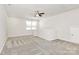 Cozy loft provides natural light from a window and neutral carpeting at 9650 Liberty Hill Dr, Mint Hill, NC 28227