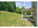 Spacious backyard with a covered patio, perfect for outdoor entertaining and relaxation at 117 Cramerton Mills Pkwy, Cramerton, NC 28032