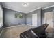 Bedroom featuring neutral gray walls, carpet, and a large window at 117 Cramerton Mills Pkwy, Cramerton, NC 28032