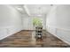 Bright dining area featuring hardwood floors and contemporary light fixture at 117 Cramerton Mills Pkwy, Cramerton, NC 28032