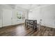 Stylish dining area with hardwood floors, modern table, and ample natural light at 117 Cramerton Mills Pkwy, Cramerton, NC 28032