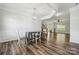 Elegant dining area featuring modern light fixture and hardwood flooring at 117 Cramerton Mills Pkwy, Cramerton, NC 28032