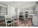 Bright kitchen with stainless steel appliances, granite countertops, and a wooden floor at 117 Cramerton Mills Pkwy, Cramerton, NC 28032
