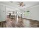 Bright open concept living area with hardwood floors that flows into kitchen at 117 Cramerton Mills Pkwy, Cramerton, NC 28032