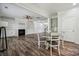 Open-concept living room featuring a fireplace, built-in shelves, and modern lighting at 117 Cramerton Mills Pkwy, Cramerton, NC 28032