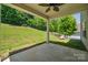 Enjoy outdoor living on this covered patio with scenic backyard view at 117 Cramerton Mills Pkwy, Cramerton, NC 28032