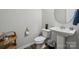 Cozy powder room with pedestal sink, modern fixtures, and stylish decor at 117 Cramerton Mills Pkwy, Cramerton, NC 28032