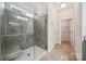 The walk-in shower features gray tile and a glass door at 117 Cramerton Mills Pkwy, Cramerton, NC 28032