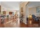 Elegant dining room featuring hardwood floors and a dazzling chandelier at 12502 Bending Branch Rd, Charlotte, NC 28227