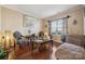 Cozy living room with hardwood floors, large window, and comfortable seating at 12502 Bending Branch Rd, Charlotte, NC 28227