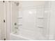 Bright, clean bathroom with new, white bath tub at 13024 Suncreek Ter, Charlotte, NC 28214