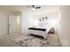 Modern bedroom with a ceiling fan, neutral walls, and a decorative rug at 13024 Suncreek Ter, Charlotte, NC 28214