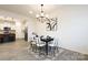 Dining area with a contemporary chandelier and a modern table setting at 13024 Suncreek Ter, Charlotte, NC 28214