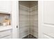 Pantry with multiple levels of shelving, maximizing storage space at 13024 Suncreek Ter, Charlotte, NC 28214