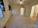 A cozy bedroom featuring carpeted floors, and a ceiling fan for optimal comfort at 1419 Ridge St, Albemarle, NC 28001