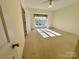 Inviting bedroom with natural light, neutral tones, and carpeted flooring, providing a warm atmosphere at 1419 Ridge St, Albemarle, NC 28001