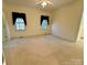 Spacious bedroom with carpet, a ceiling fan and natural light at 1419 Ridge St, Albemarle, NC 28001