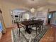 Chic dining room with elegant chandelier, hardwood floors, and open flow to living spaces at 1419 Ridge St, Albemarle, NC 28001