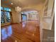 Open dining room showcasing a chandelier, hardwood floors, and seamless flow into adjoining rooms at 1419 Ridge St, Albemarle, NC 28001