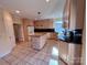 Kitchen with a center island, ample cabinet space, and tile floors at 1419 Ridge St, Albemarle, NC 28001