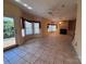 Bright living room with large tile flooring and natural light streaming through the windows at 1419 Ridge St, Albemarle, NC 28001