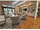 Bright living room featuring hardwood floors, built-in shelving, and large windows with natural light at 1419 Ridge St, Albemarle, NC 28001