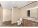 Bathroom with single sink vanity, toilet, and shower/tub combo at 143 Lakewind Dr, Mooresville, NC 28115