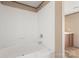 Bathroom features a tub/shower combo with white walls at 143 Lakewind Dr, Mooresville, NC 28115