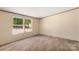 Bedroom featuring natural light and views from multiple windows at 143 Lakewind Dr, Mooresville, NC 28115