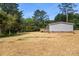 Home exterior showing a spacious yard with a foundation made of brick at 143 Lakewind Dr, Mooresville, NC 28115