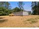 Exterior view of the home, featuring a spacious yard and fresh landscaping at 143 Lakewind Dr, Mooresville, NC 28115